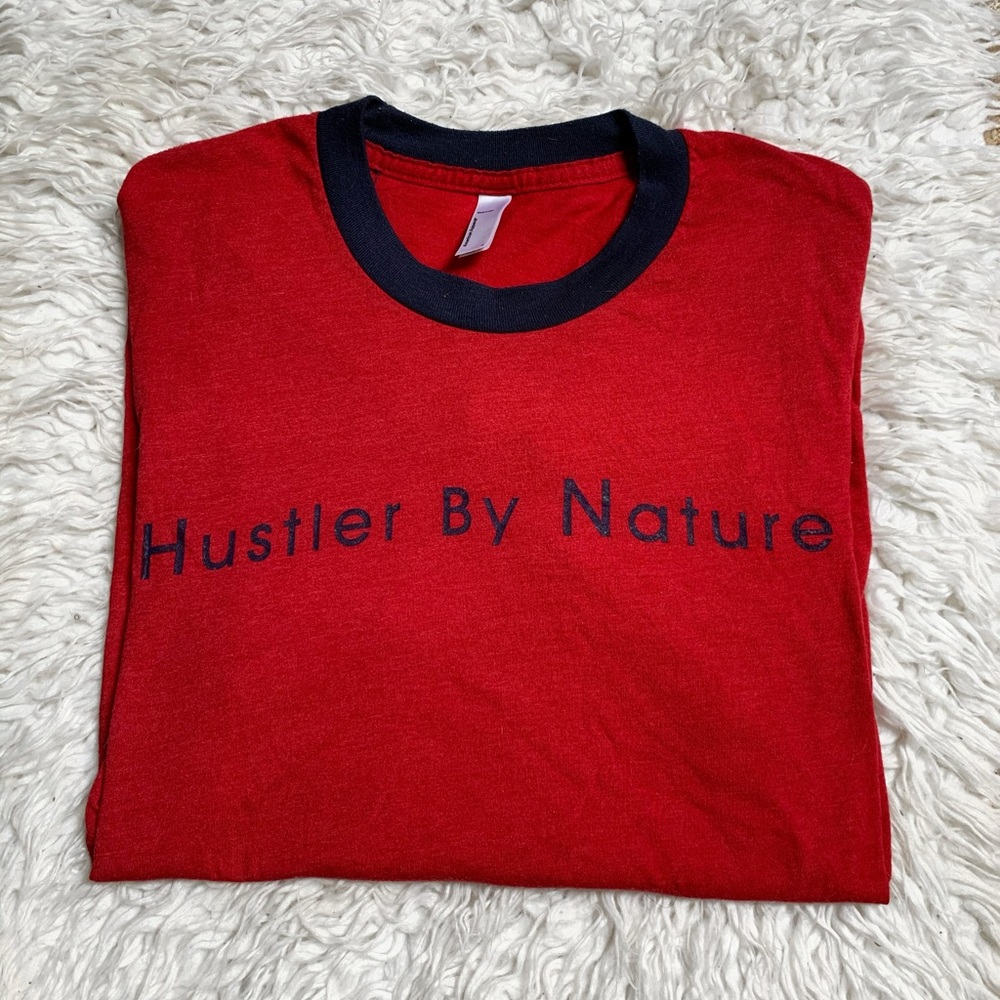 American Apperal “Hustler by Nature” tshirt